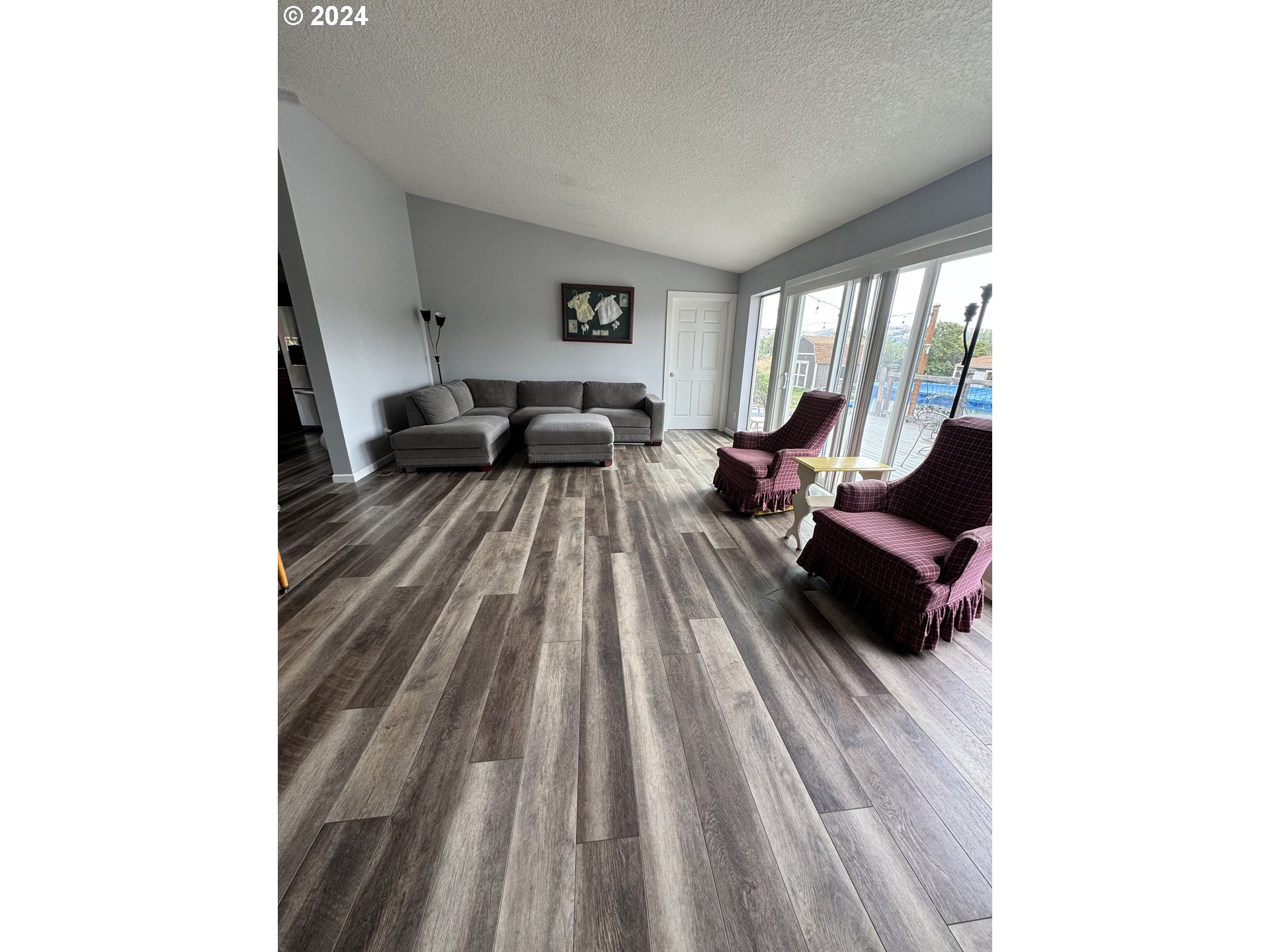 508 3rd Avenue Dallesport, WA 98617 - Photo 8 of 48 a living room with furniture and a large window