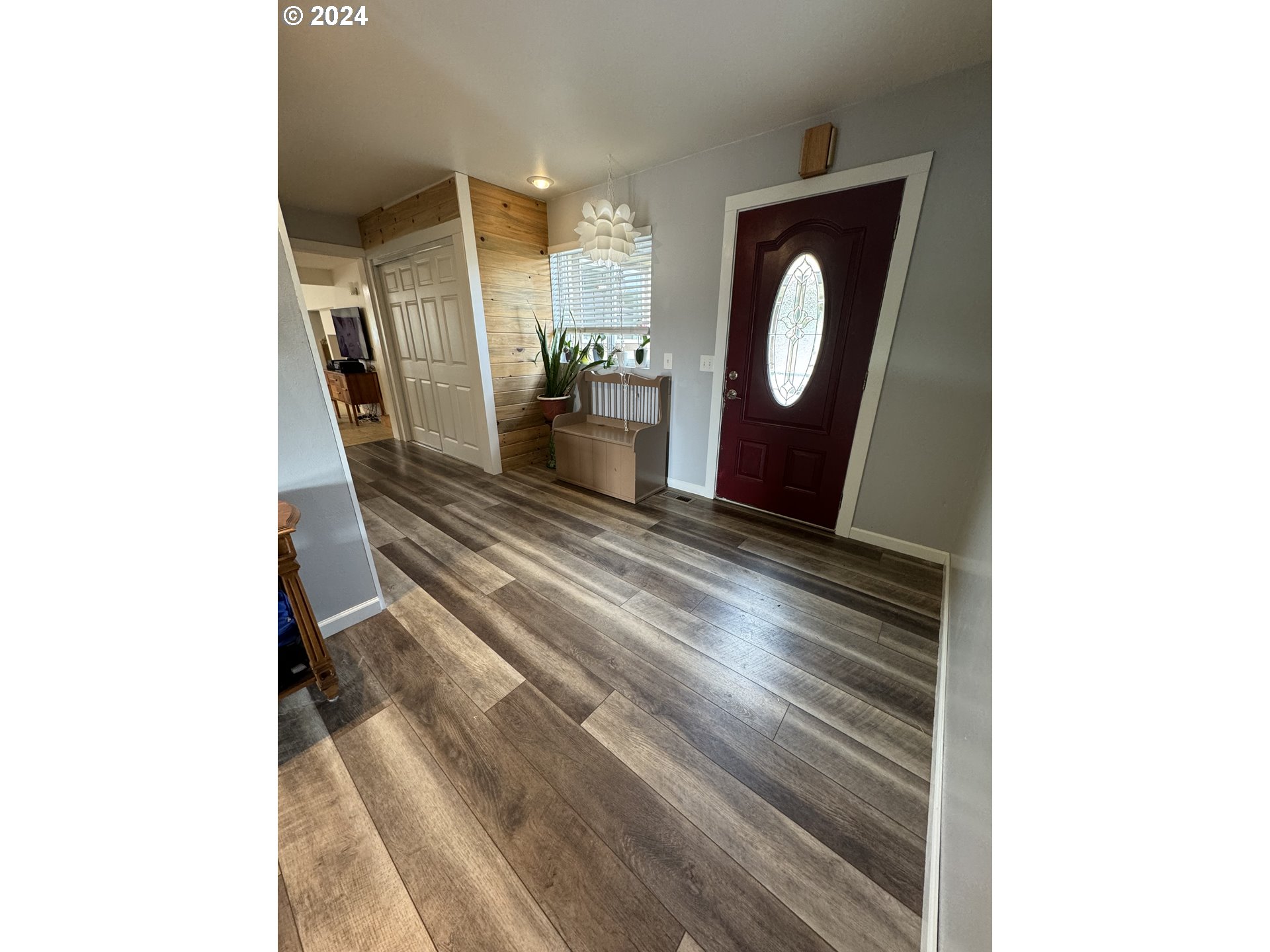 508 3rd Avenue Dallesport, WA 98617 - Photo 9 of 48 a view of a hallway with wooden floor