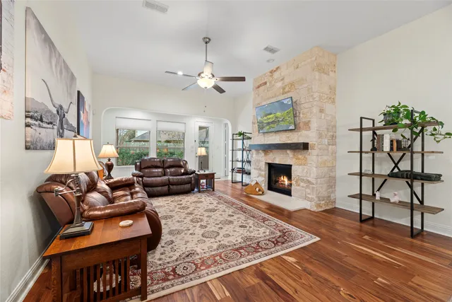 a living room with furniture and a fireplace