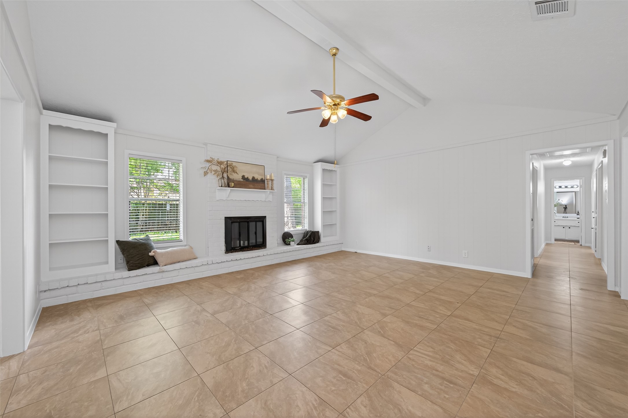 23919 Farm Hill Drive Spring, TX 77373 - Photo 11 of 41 an empty room with windows and fireplace