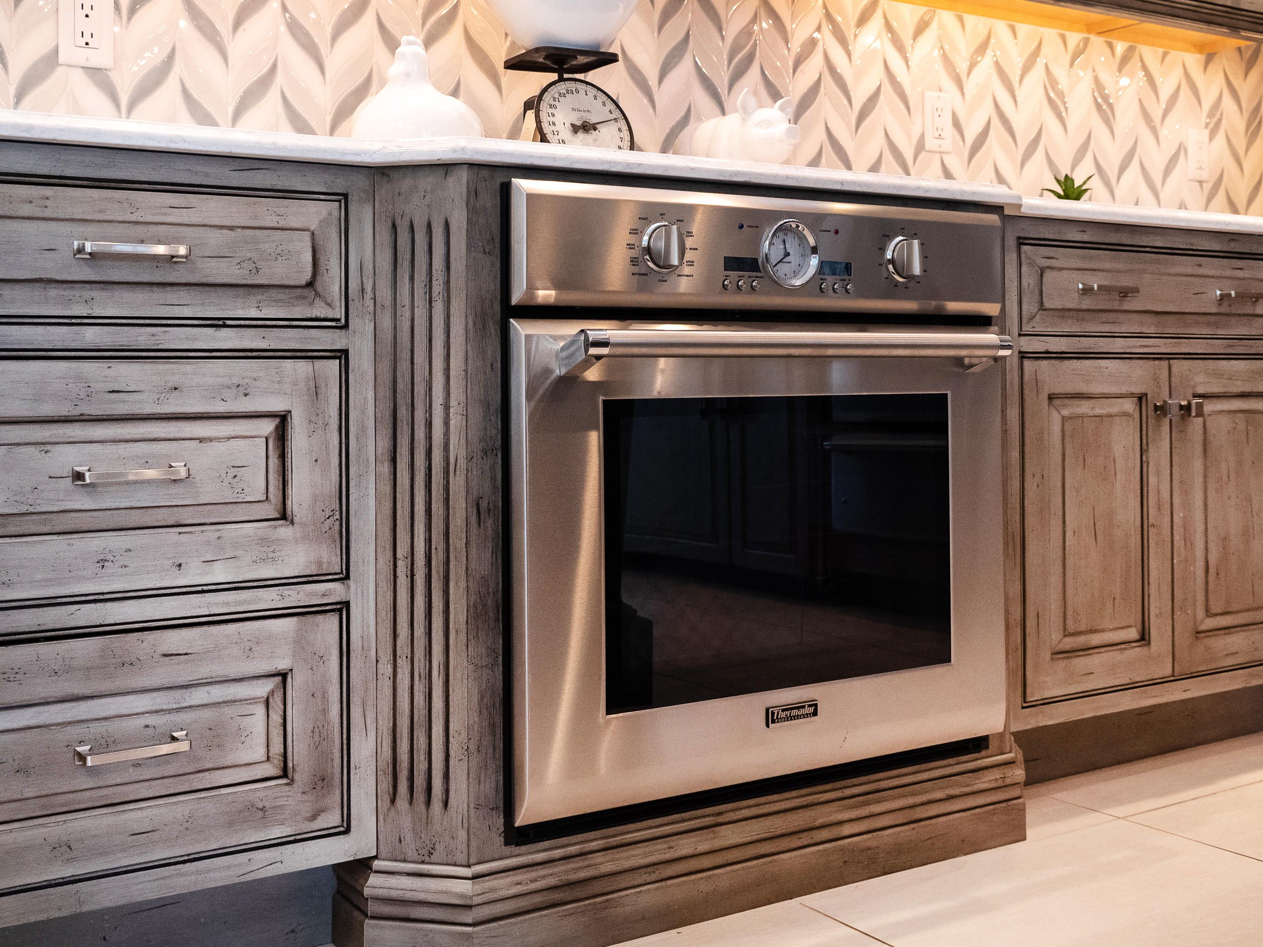 7 Preston Square, Unit 7 Quincy, MA 02171 - Photo 11 of 30 a stove top oven sitting inside of a kitchen