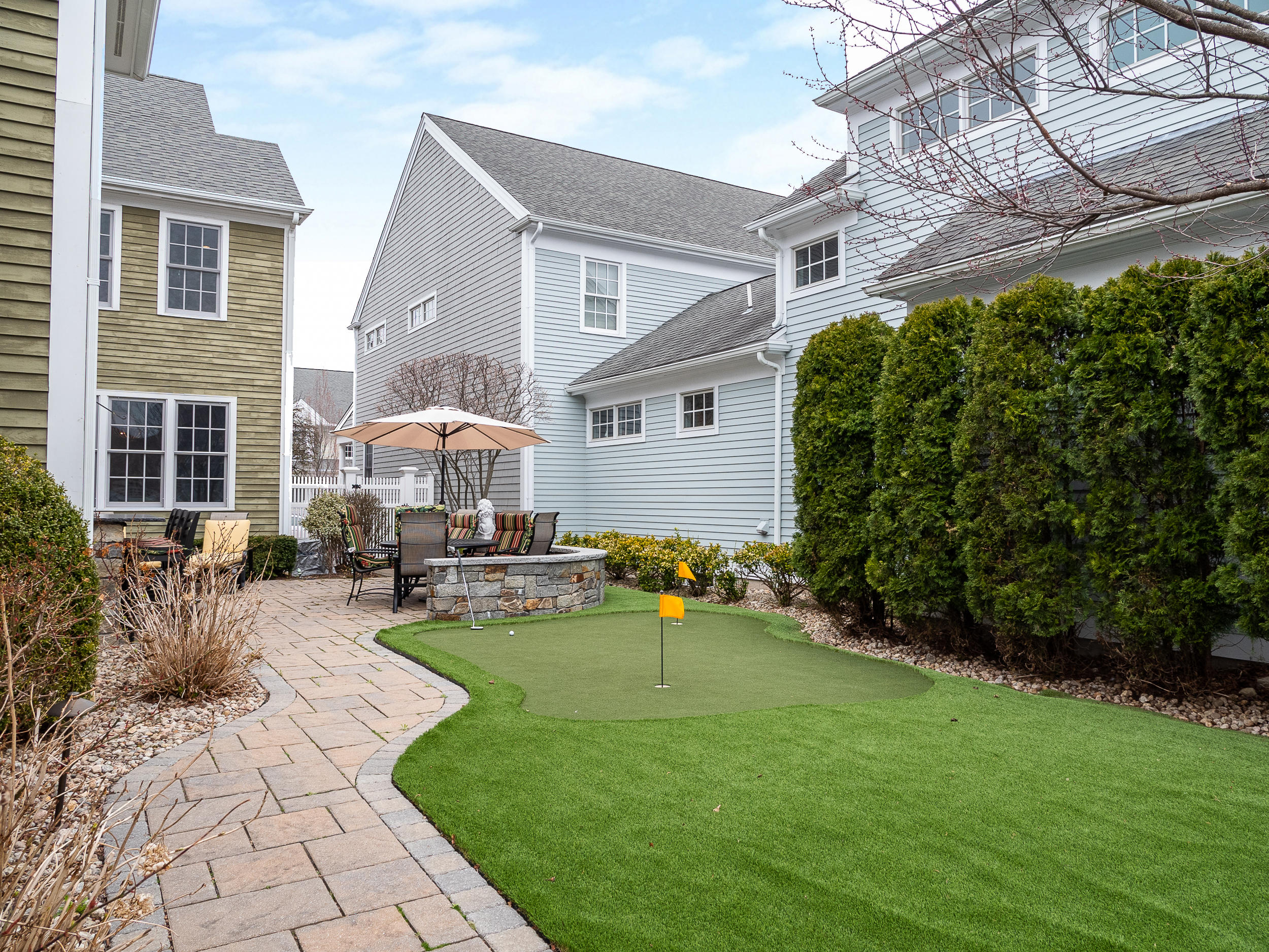 7 Preston Square, Unit 7 Quincy, MA 02171 - Photo 26 of 30 a view of a house with backyard sitting area and garden
