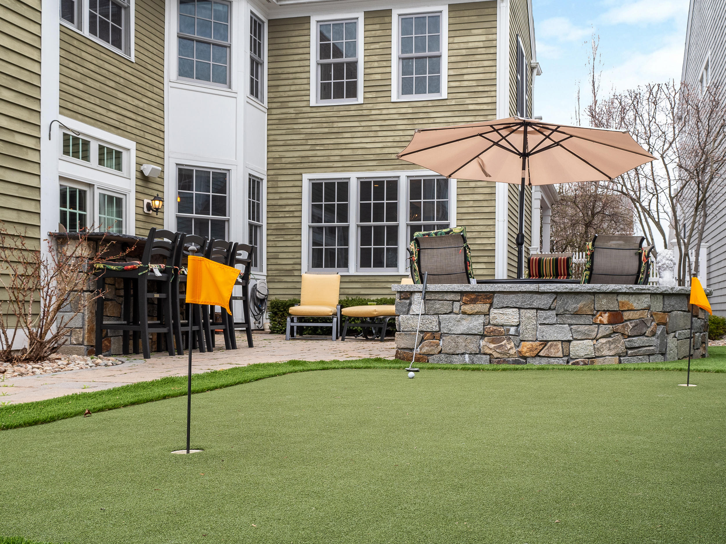 7 Preston Square, Unit 7 Quincy, MA 02171 - Photo 27 of 30 a view of a house with backyard and sitting area