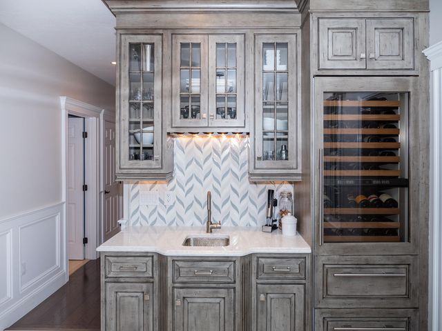 a kitchen with a sink and cabinets