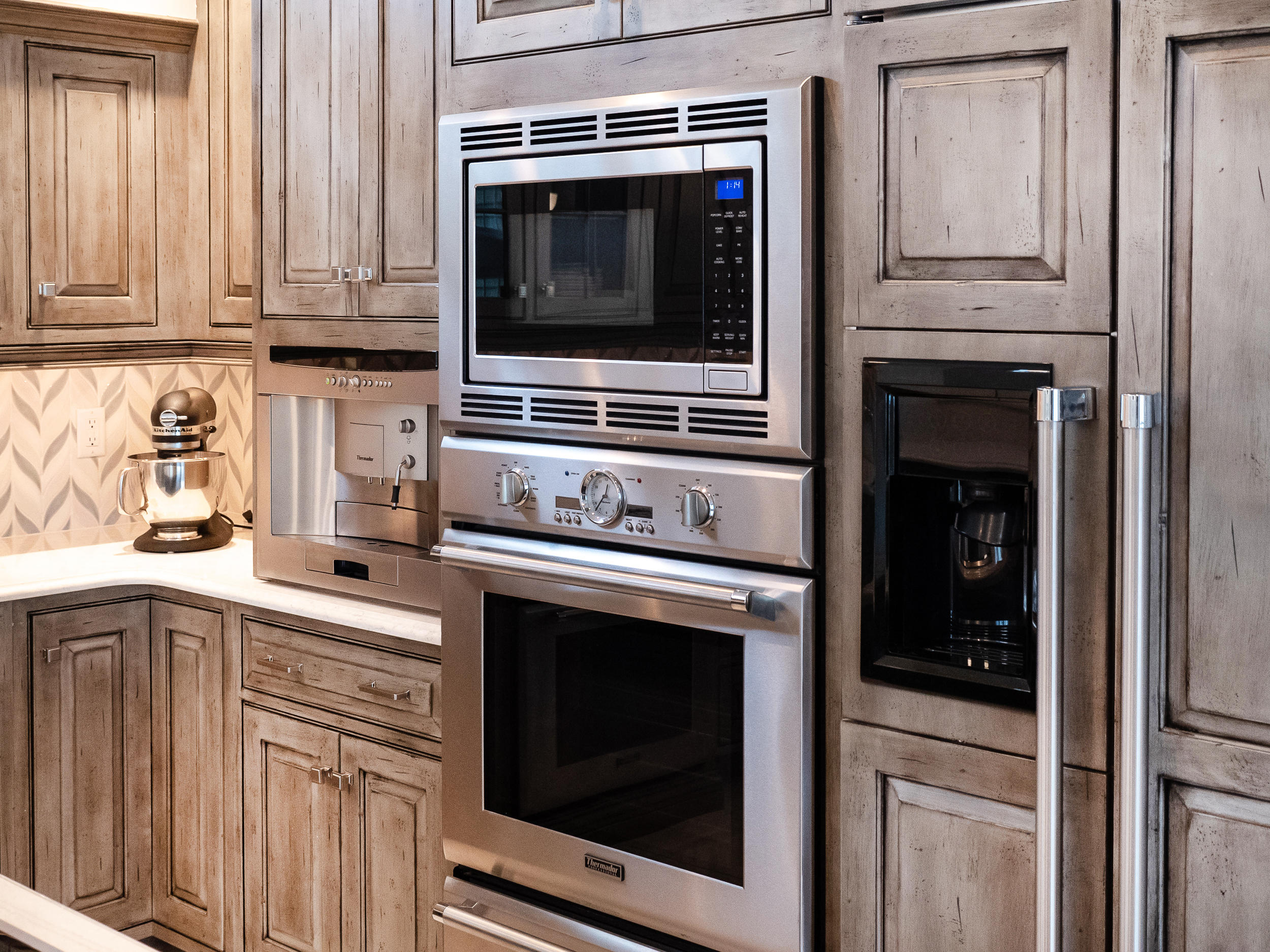 7 Preston Square, Unit 7 Quincy, MA 02171 - Photo 10 of 30 a kitchen with granite countertop white cabinets and stainless steel appliances