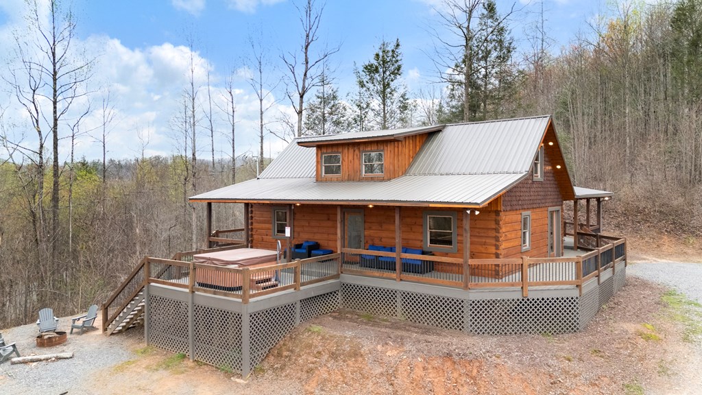 136 B Pack Creek Road Blue Ridge, GA 30513 - Photo 20 of 87 a view of a chairs and table in the terrace