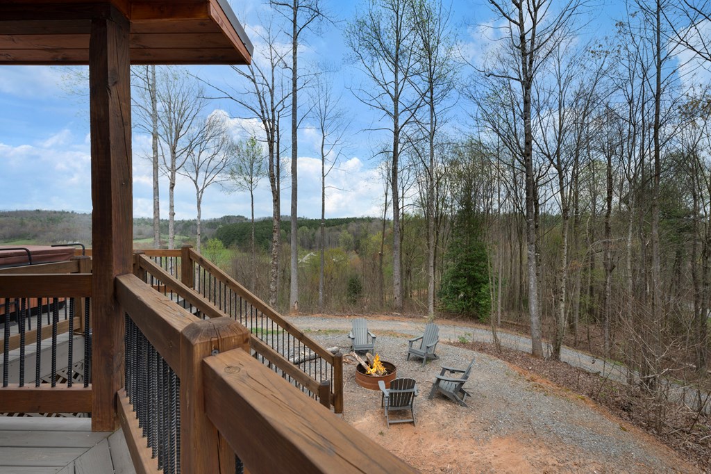 136 B Pack Creek Road Blue Ridge, GA 30513 - Photo 49 of 87 a view of a balcony with two chairs and a table