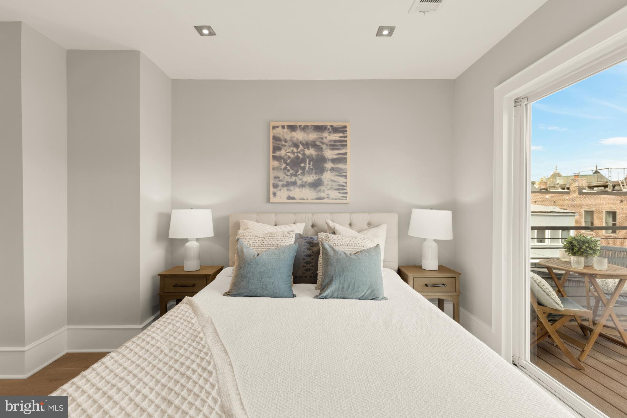 1735 1st Street Northwest, Unit 2 Washington, DC 20001 - Photo 21 of 38 a bedroom with a bed and lamp