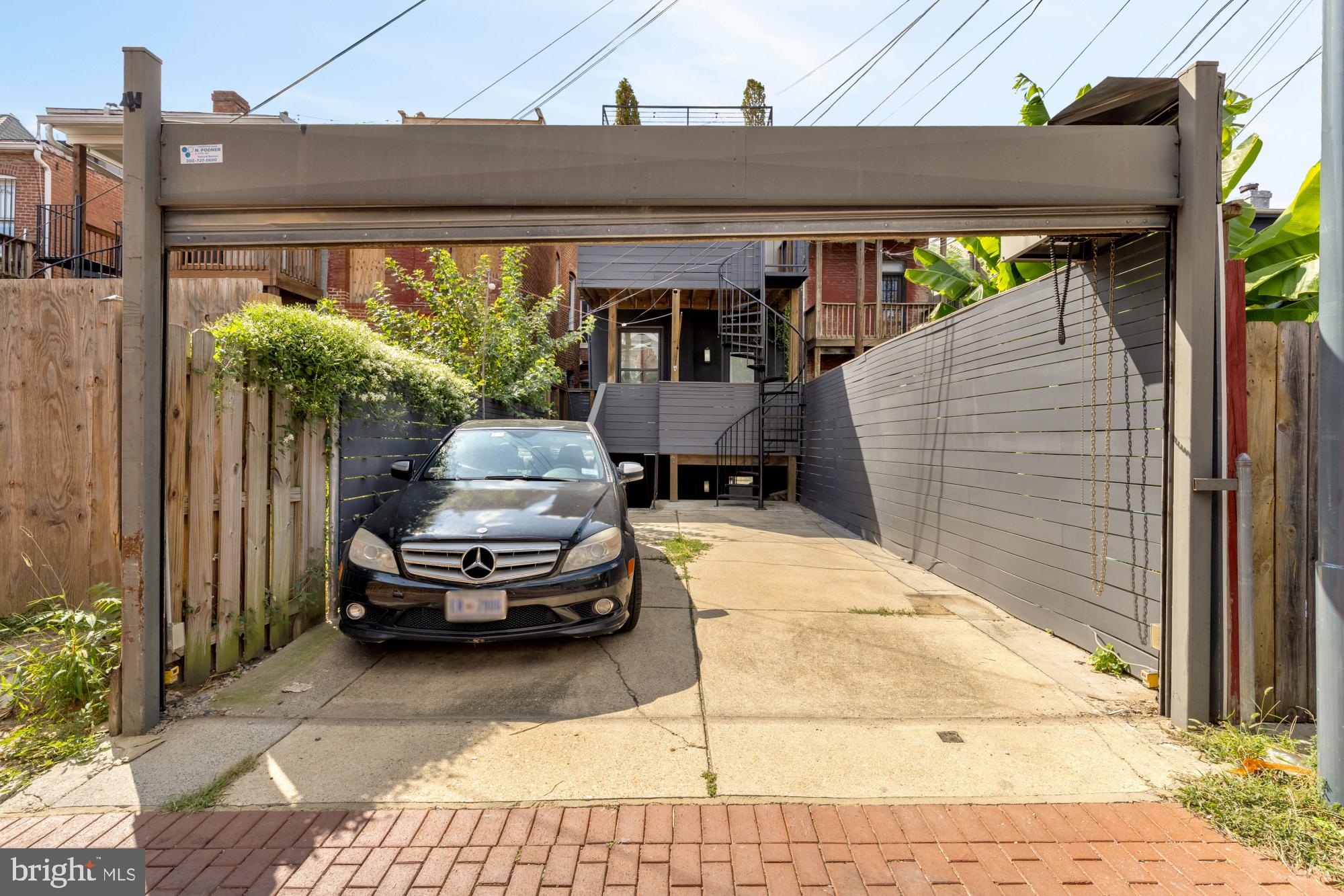 1735 1st Street Northwest, Unit 2 Washington, DC 20001 - Photo 36 of 38 a car parked in front of a house