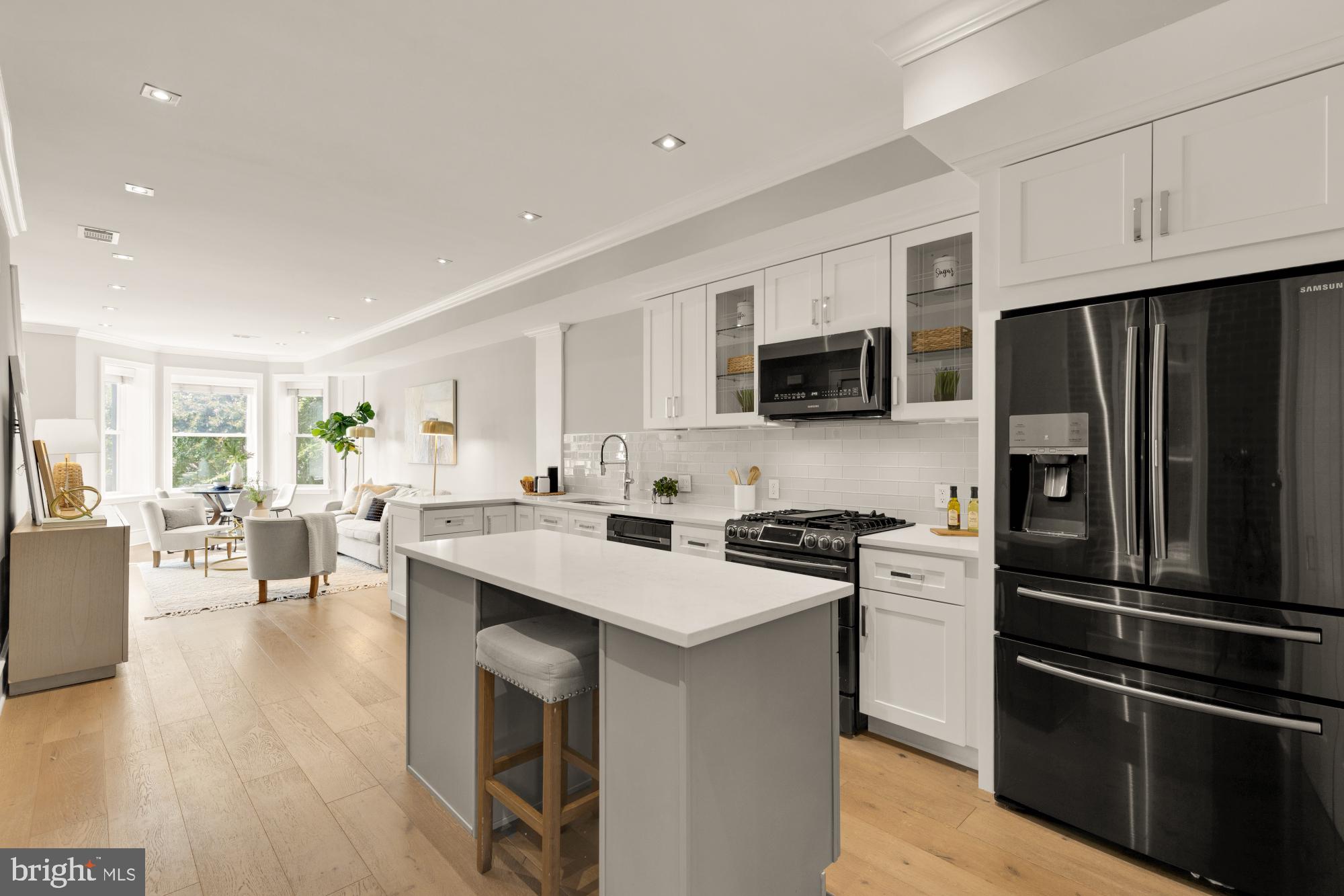 1735 1st Street Northwest, Unit 2 Washington, DC 20001 - Photo 4 of 38 a kitchen with stainless steel appliances a stove refrigerator sink and microwave
