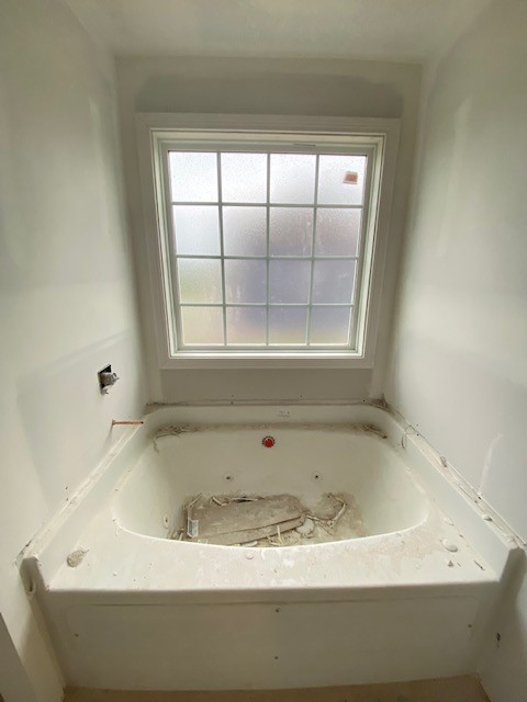 3612 Oakland Road Clarksville, TN 37040 - Photo 11 of 17 a white bath tub sitting in a bathroom next to a window