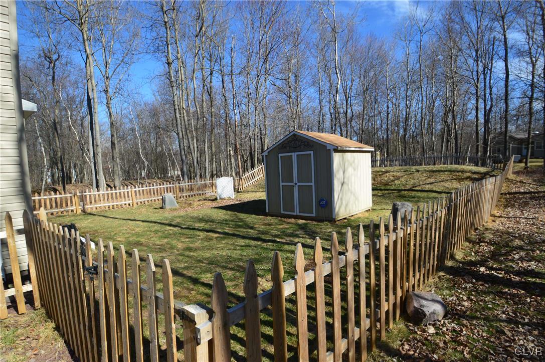 1121 Boulder Road Blakeslee, PA 18610 - Photo 23 of 25 a view of a chair and table with wooden fence