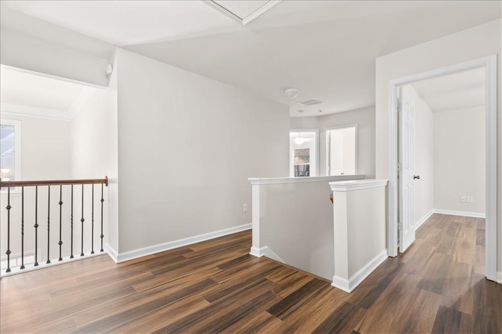 4740 Shiloh Crossing Way Cumming, GA 30040 - Photo 14 of 25 a view of a room with wooden floor