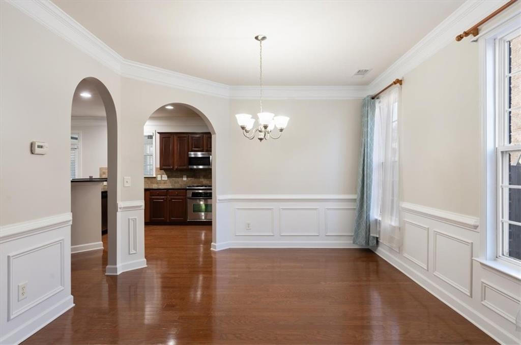 4740 Shiloh Crossing Way Cumming, GA 30040 - Photo 7 of 25 a view of a kitchen with a sink and a stove top oven