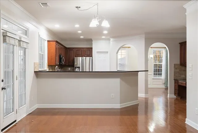 a view of entryway with stairs and wooden floor