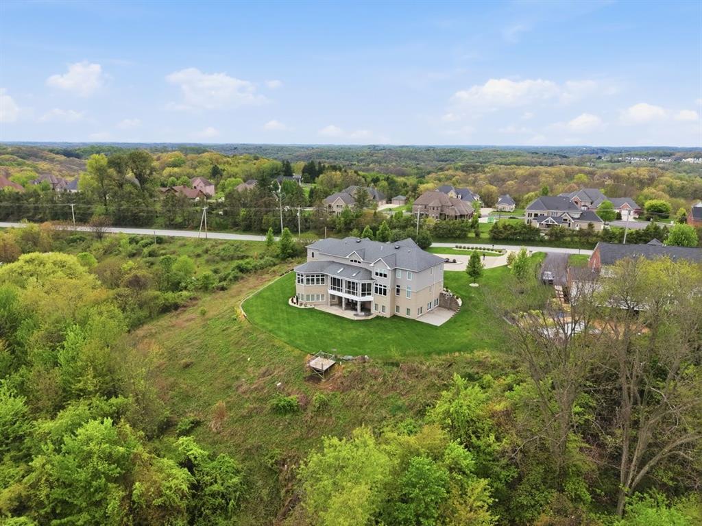 931 Pleasant Hill Road Wexford, PA 15090 - Photo 3 of 50 a view of a lake with houses in the back