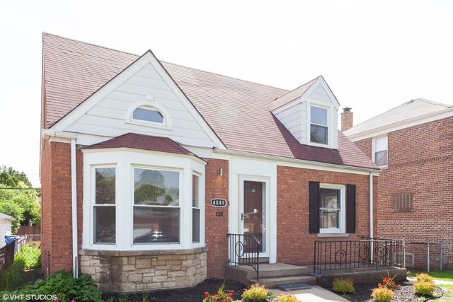 a hallway and entryway with wooden floor