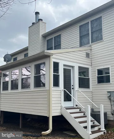 a front view of a house with many windows