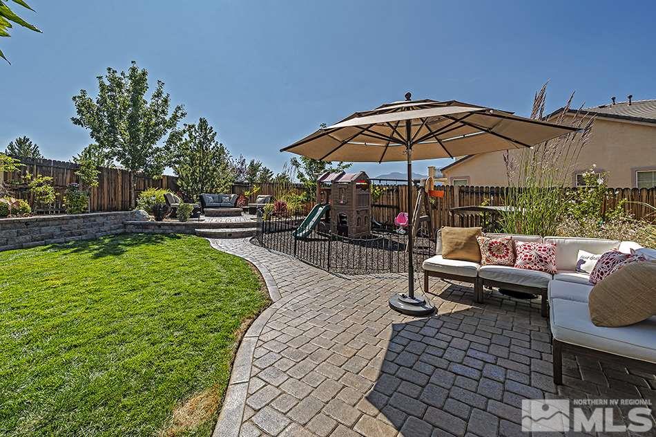 1578 Gemtown Court Reno, NV 89521 - Photo 23 of 25 an outdoor sitting area with furniture and umbrella