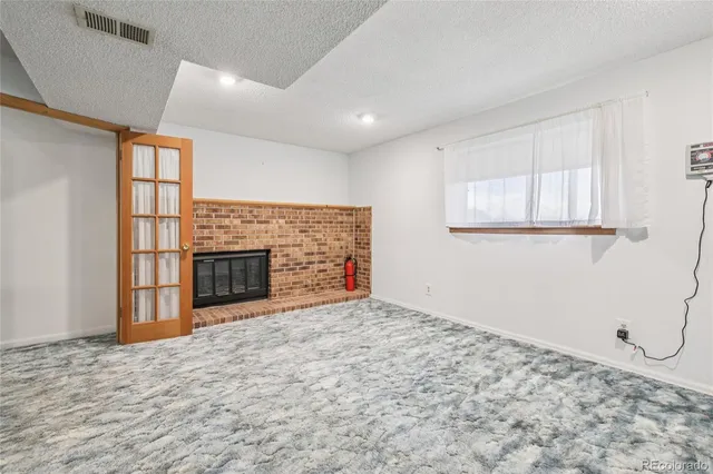 a view of a livingroom with a fireplace