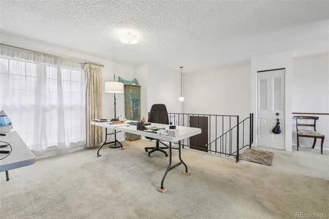 a work room with furniture and a window