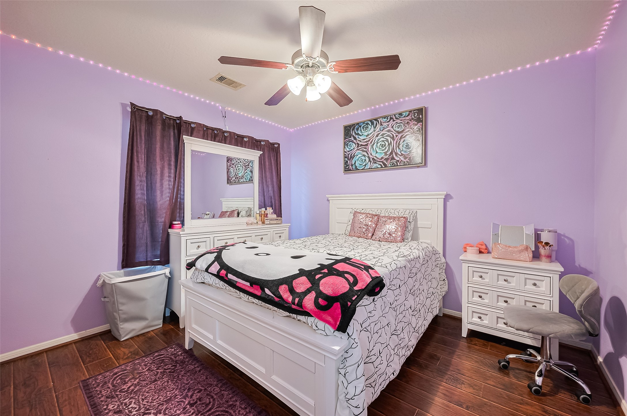 723 Pine Thicket Court Spring, TX 77373 - Photo 27 of 40 a bedroom with a bed a chandelier and a dresser