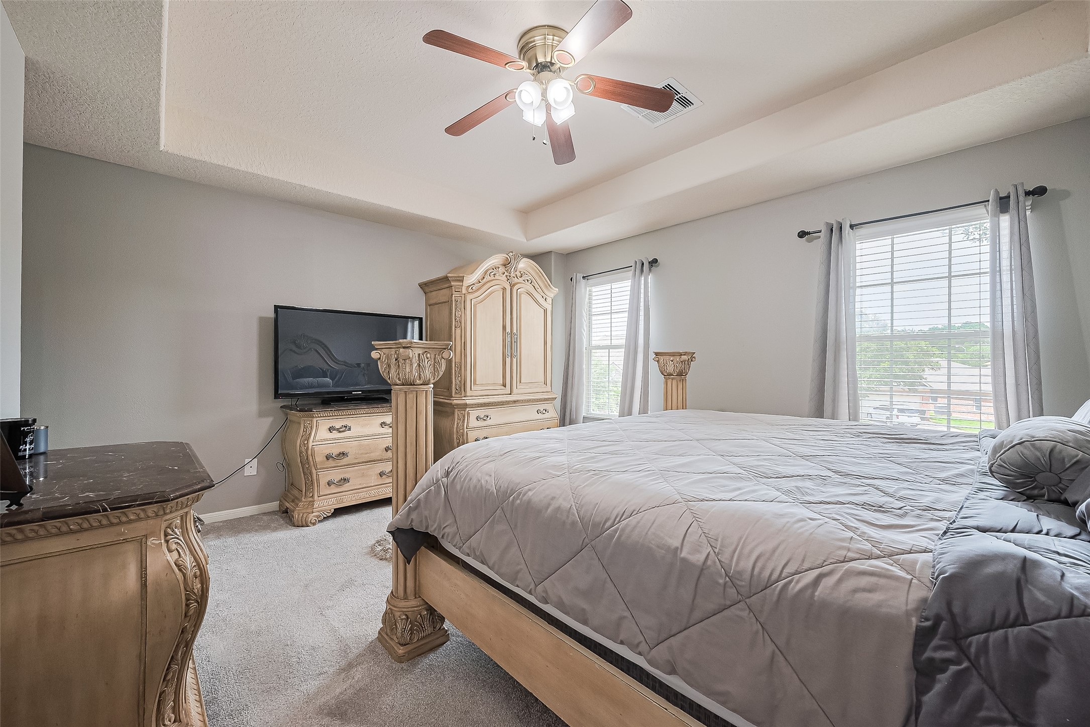 723 Pine Thicket Court Spring, TX 77373 - Photo 31 of 40 a bedroom with a bed and a flat screen tv