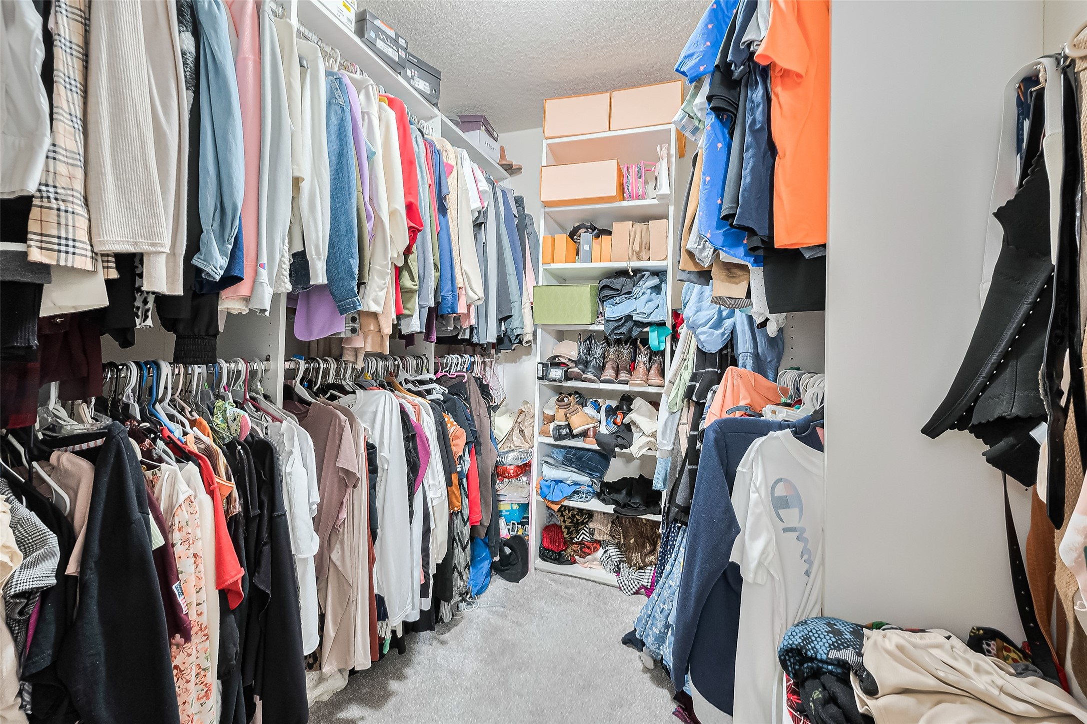 723 Pine Thicket Court Spring, TX 77373 - Photo 35 of 40 a view of walk in closet with clothes and shoes