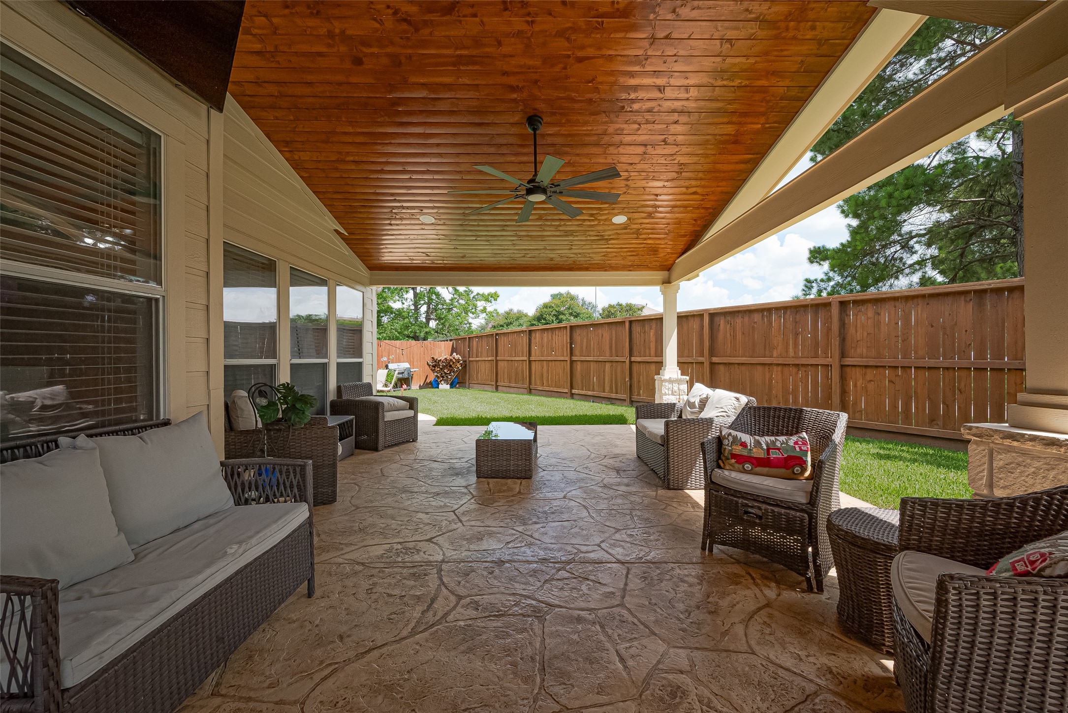 723 Pine Thicket Court Spring, TX 77373 - Photo 36 of 40 a outdoor space with patio the couches and a dining table with chairs