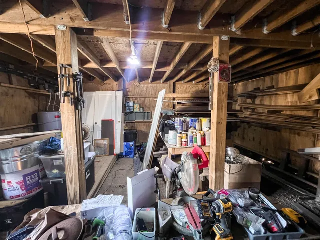 a view of a house with a wooden bench