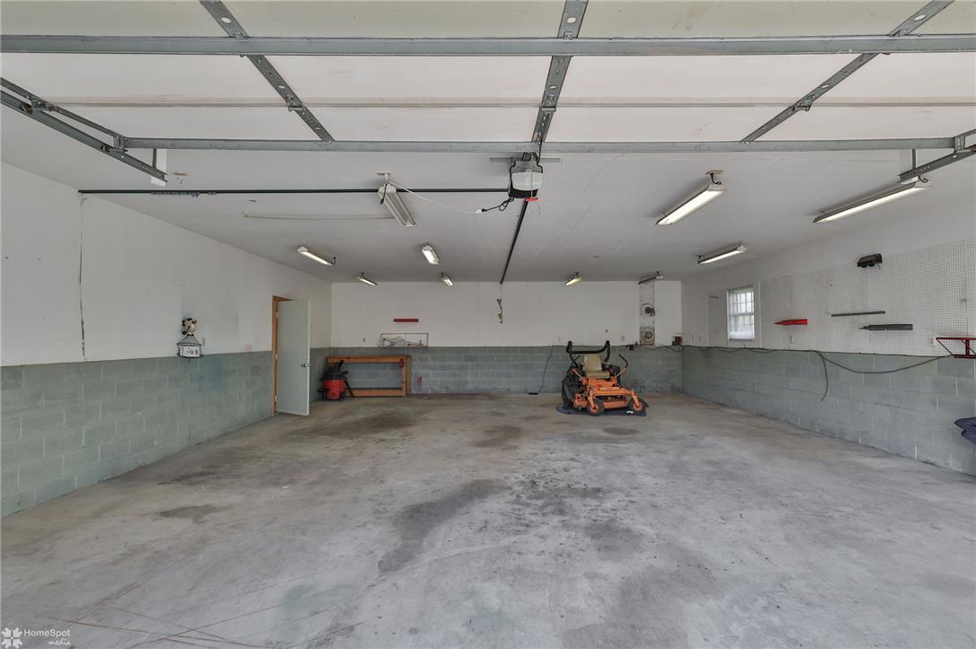 205 West Moorestown Road Wind Gap, PA 18091 - Photo 17 of 20 A spacious garage with concrete flooring provides ample room and durable surfaces.