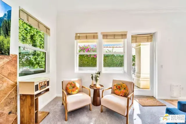 a view of a dining room with furniture window and outside view