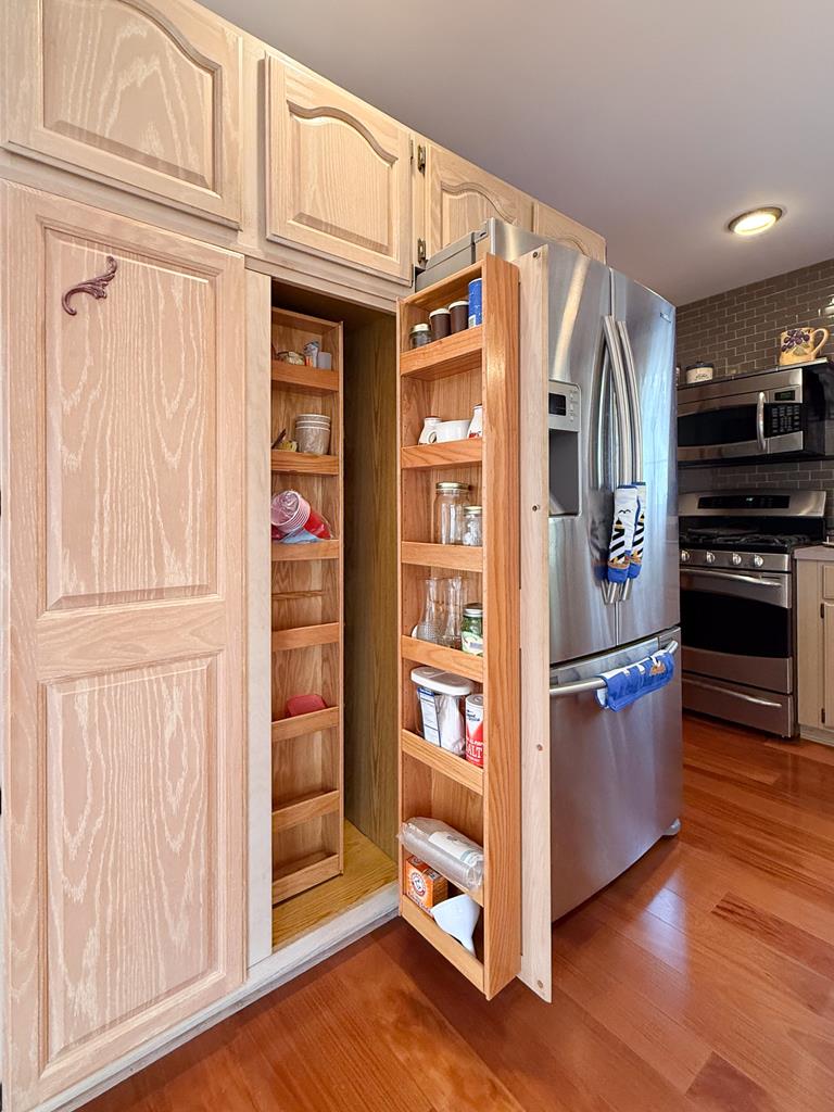13581 Solitude Trail Machipongo, VA 23405 - Photo 14 of 51 a kitchen with stainless steel appliances granite countertop a refrigerator and a stove top oven
