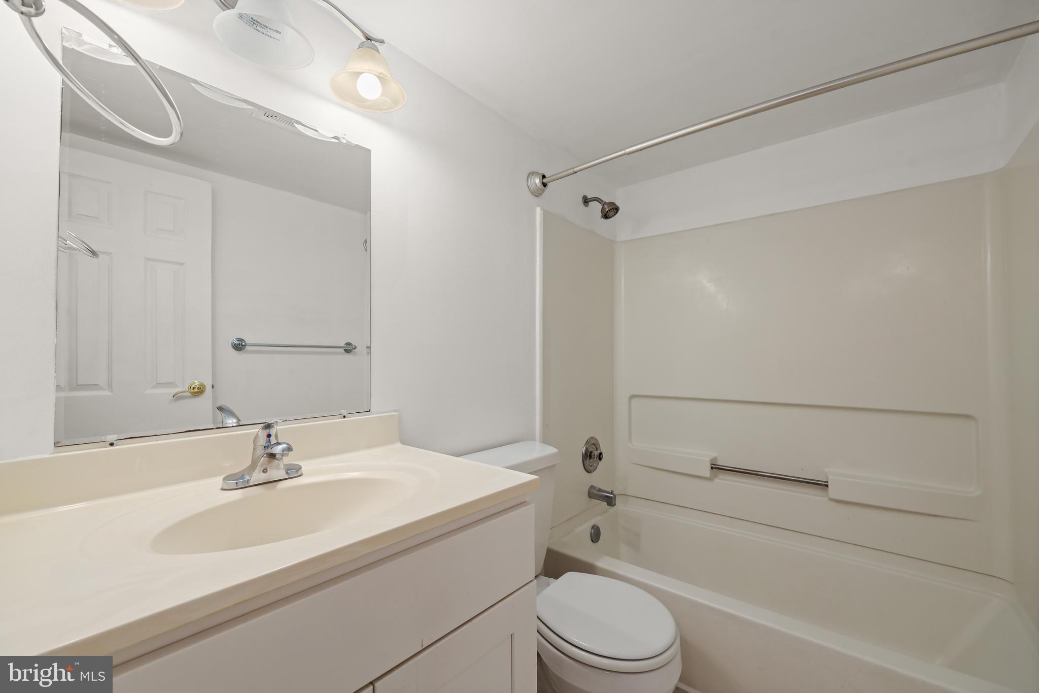 11721 Karbon Hill Court, Unit T2 Reston, VA 20191 - Photo 20 of 31 a bathroom with a sink toilet and shower