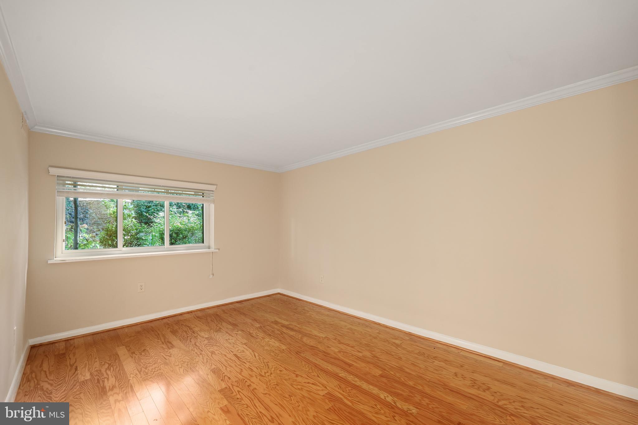 11721 Karbon Hill Court, Unit T2 Reston, VA 20191 - Photo 24 of 31 an empty room with wooden floor and windows