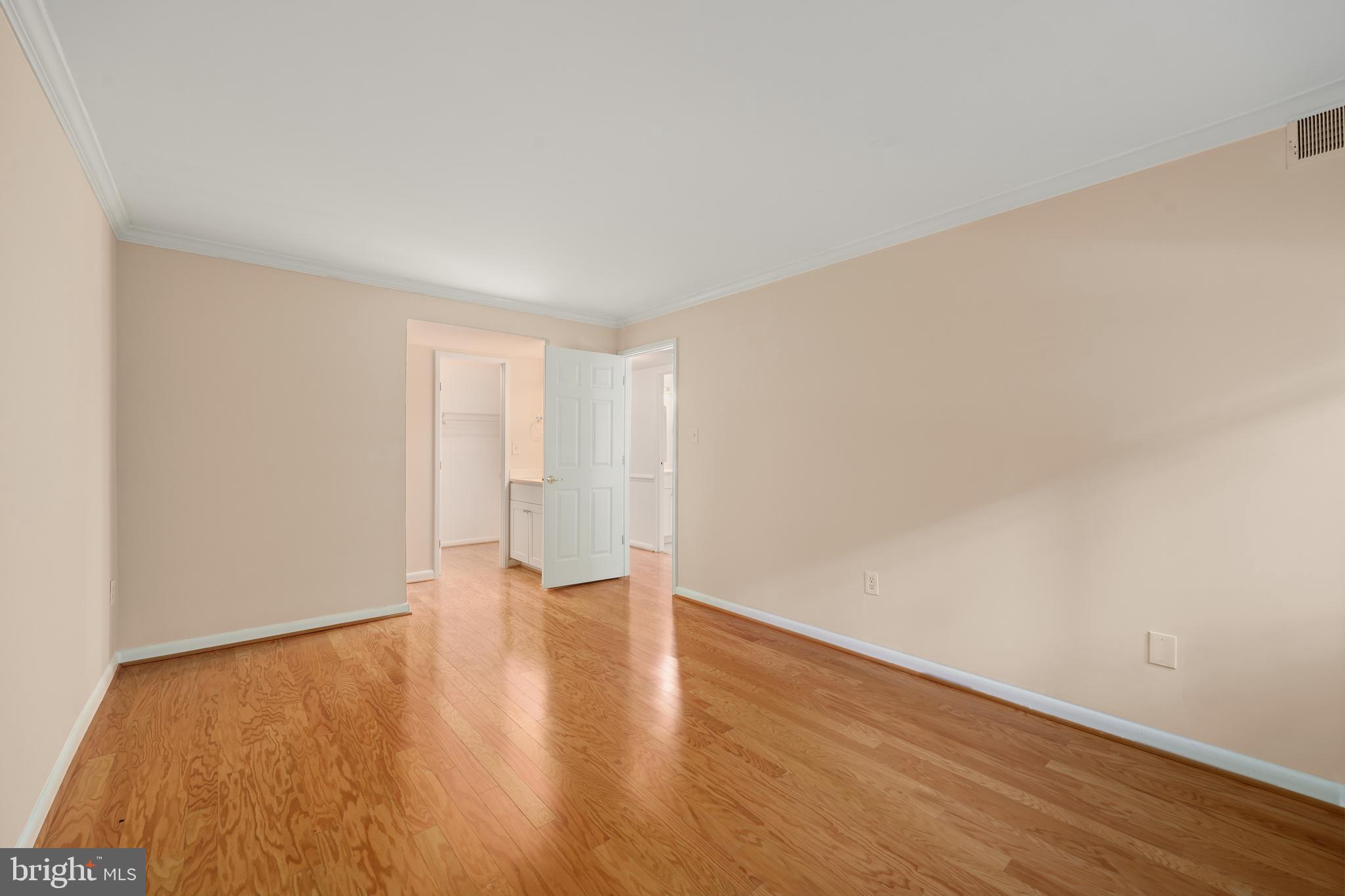 11721 Karbon Hill Court, Unit T2 Reston, VA 20191 - Photo 26 of 31 a view of an empty room with wooden floor