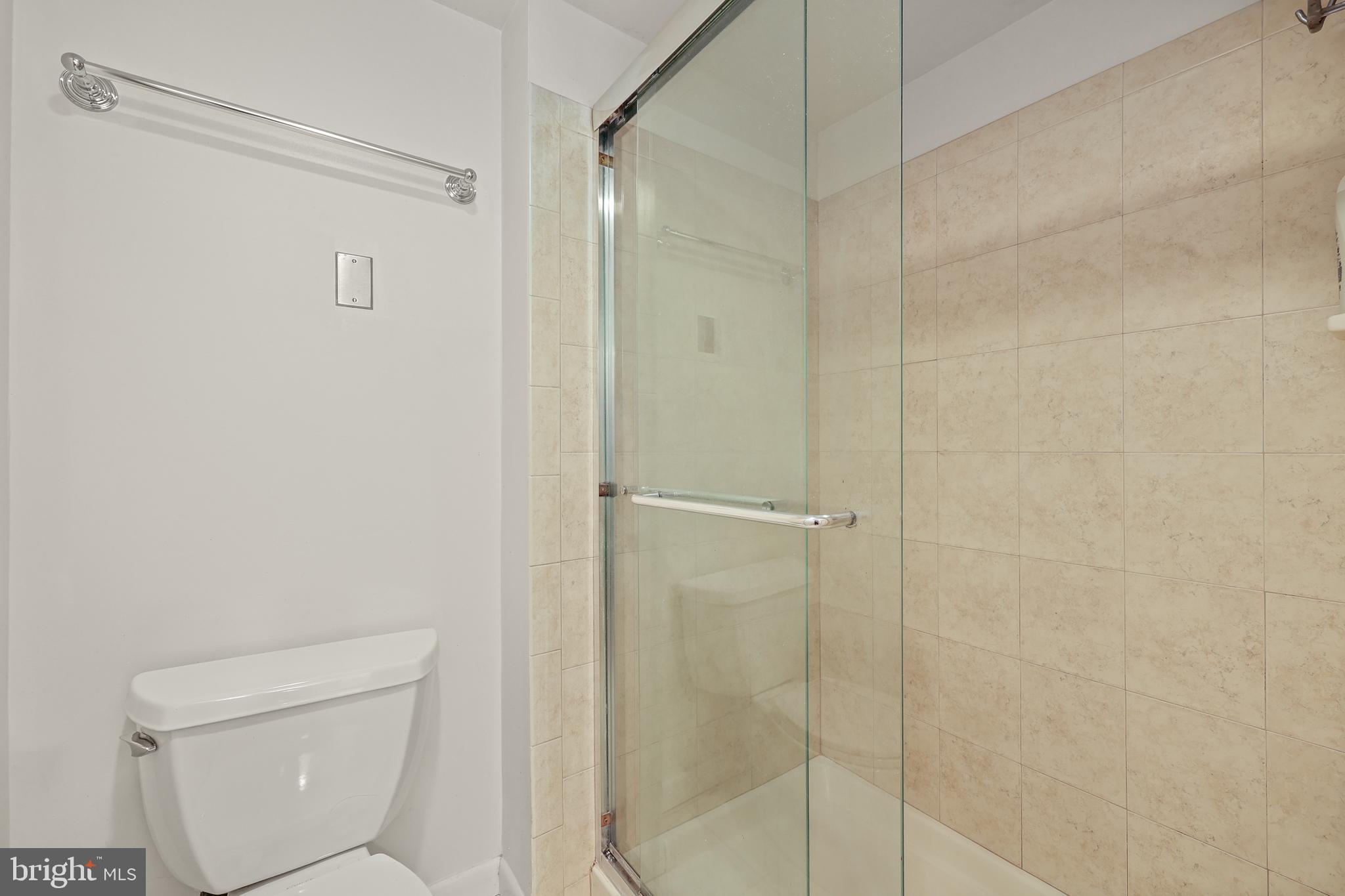 11721 Karbon Hill Court, Unit T2 Reston, VA 20191 - Photo 28 of 31 a bathroom with a shower and a toilet