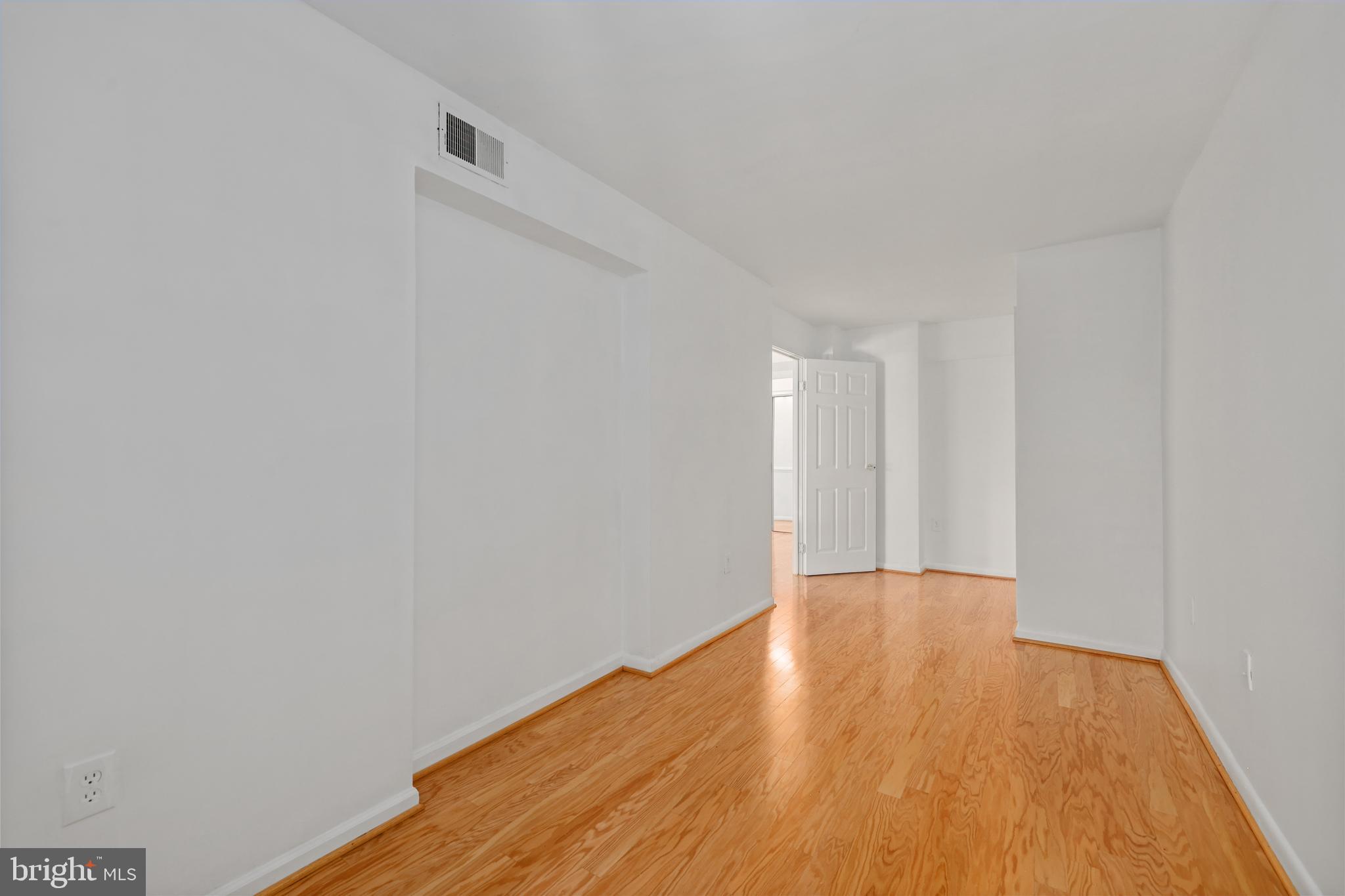 11721 Karbon Hill Court, Unit T2 Reston, VA 20191 - Photo 31 of 31 a view of an empty room with wooden floor