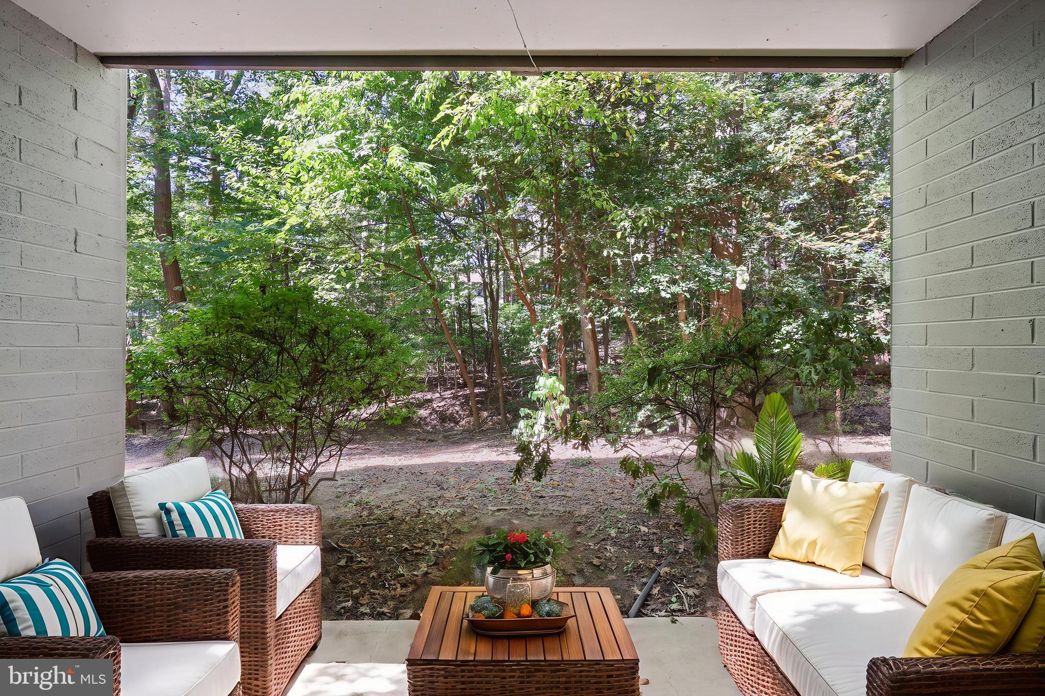 11721 Karbon Hill Court, Unit T2 Reston, VA 20191 - Photo 6 of 31 a backyard of a house with outdoor seating