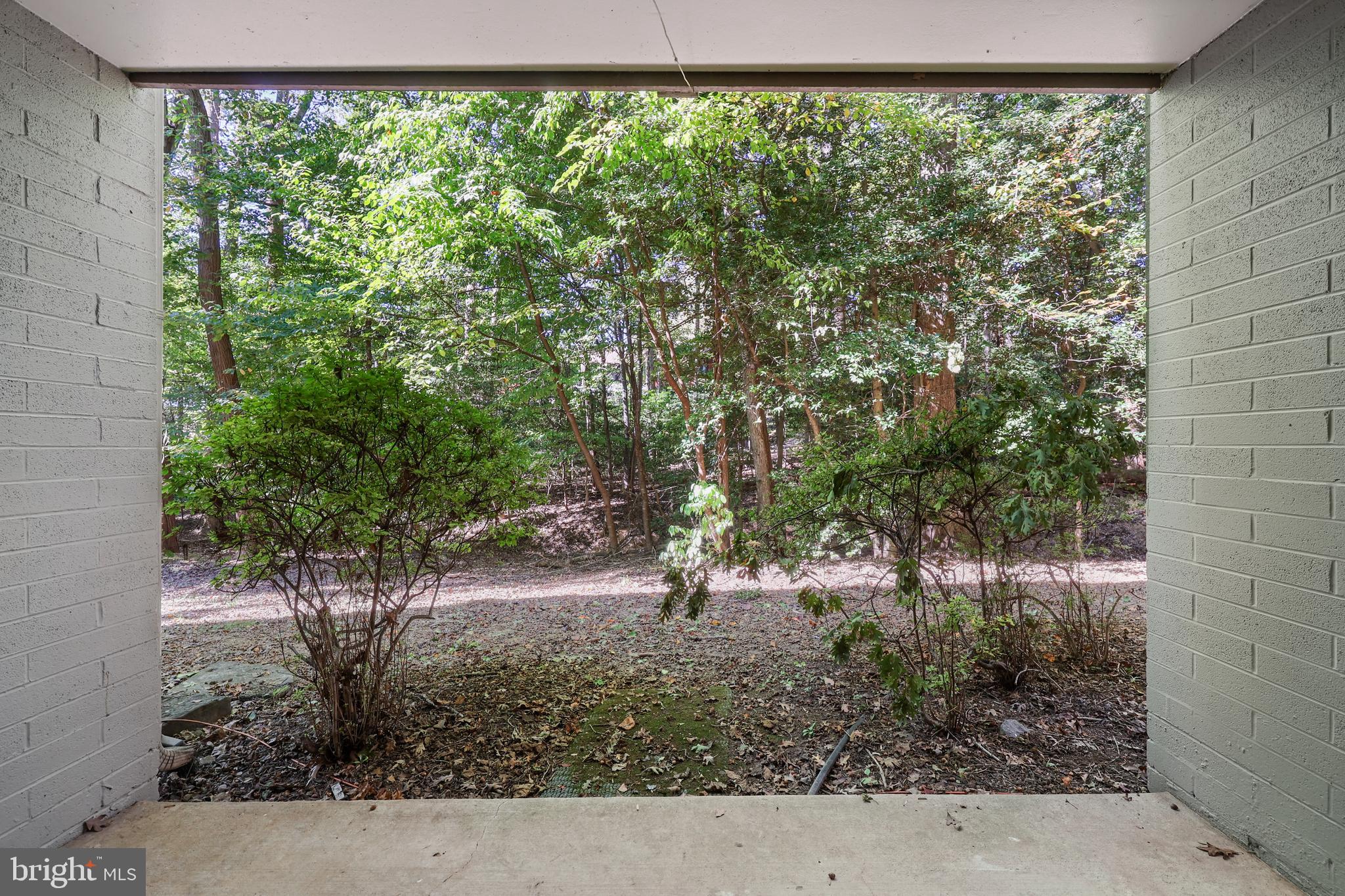 11721 Karbon Hill Court, Unit T2 Reston, VA 20191 - Photo 7 of 31 a backyard of a house with lots of green space