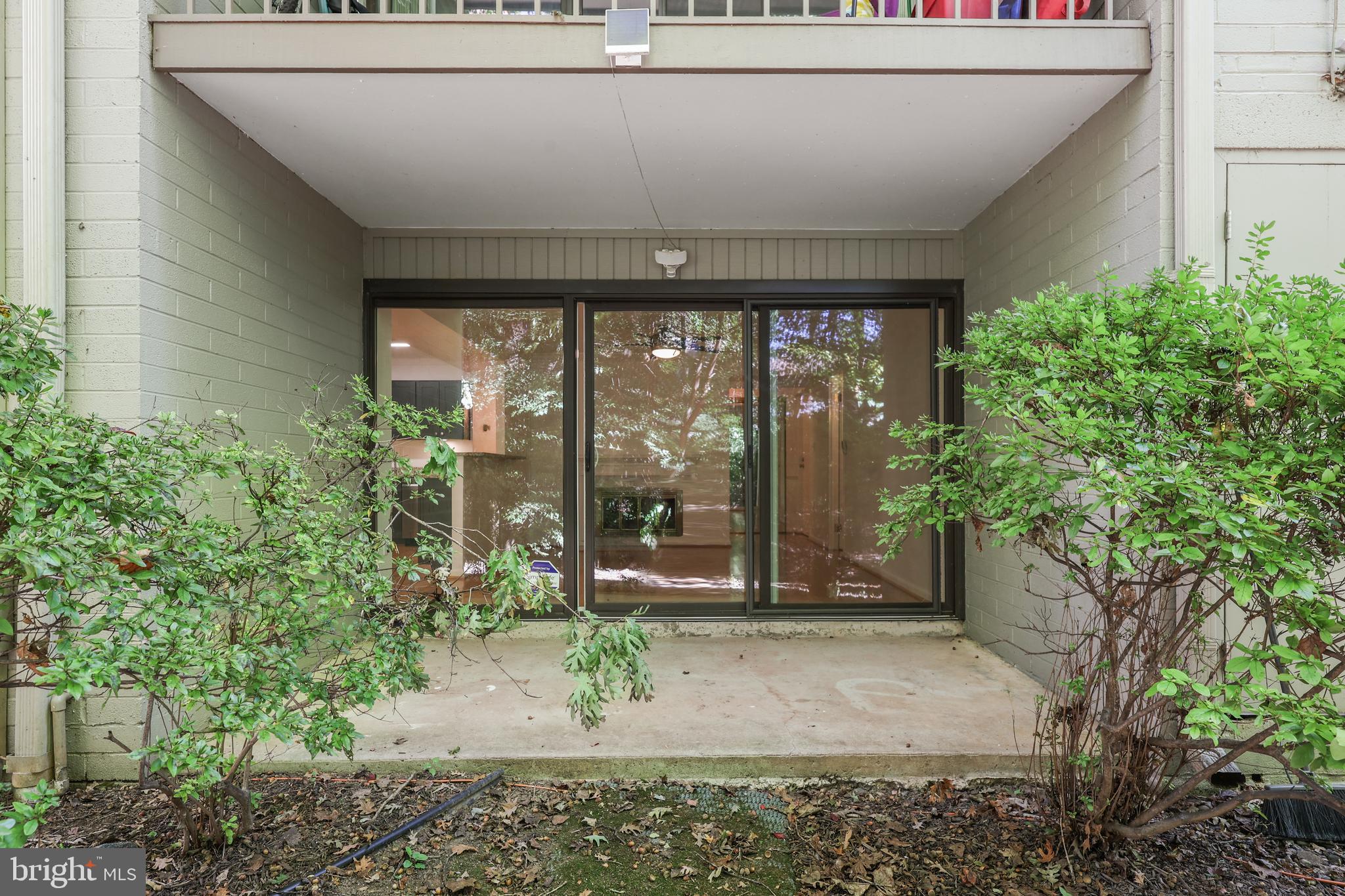 11721 Karbon Hill Court, Unit T2 Reston, VA 20191 - Photo 8 of 31 a front view of a house with garden