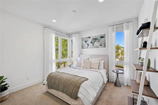 a bathroom with a toilet sink vanity and mirror