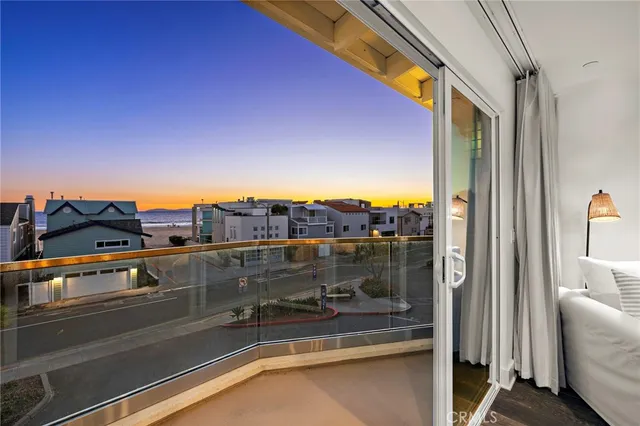 a bedroom with furniture and a flat screen tv