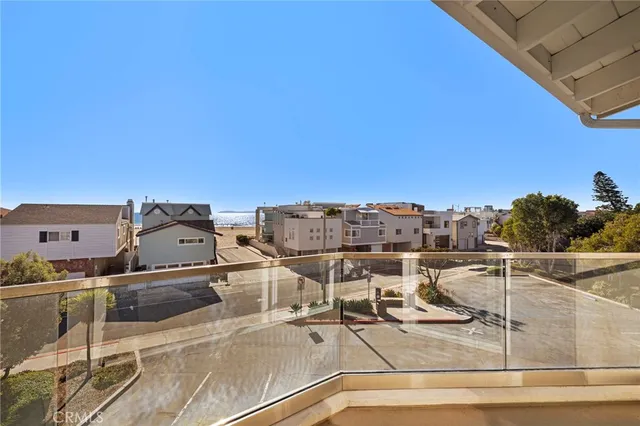 a bedroom with a white bed and ceiling fan