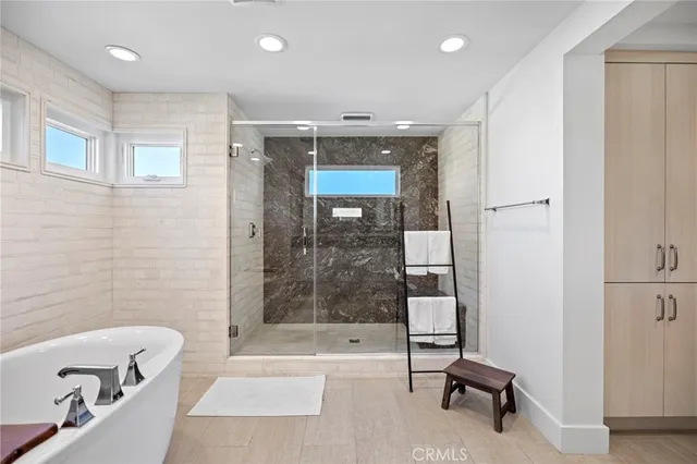 a bathroom with a bathtub and a sink