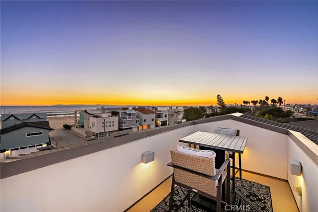 a view of a terrace with chairs and potted plants