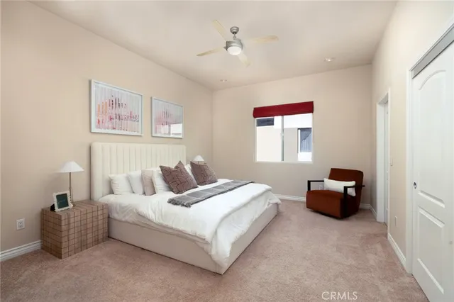 a bedroom with a bed and a couch