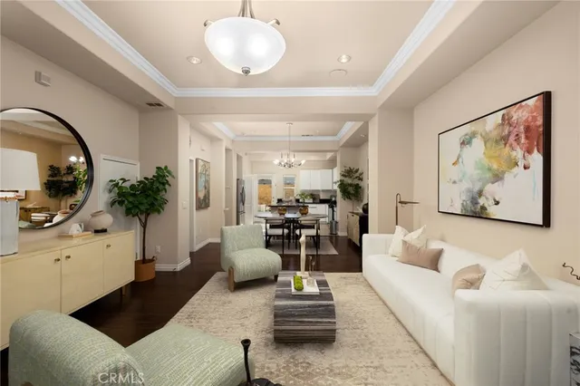 a living room with furniture a flat screen tv and a large window