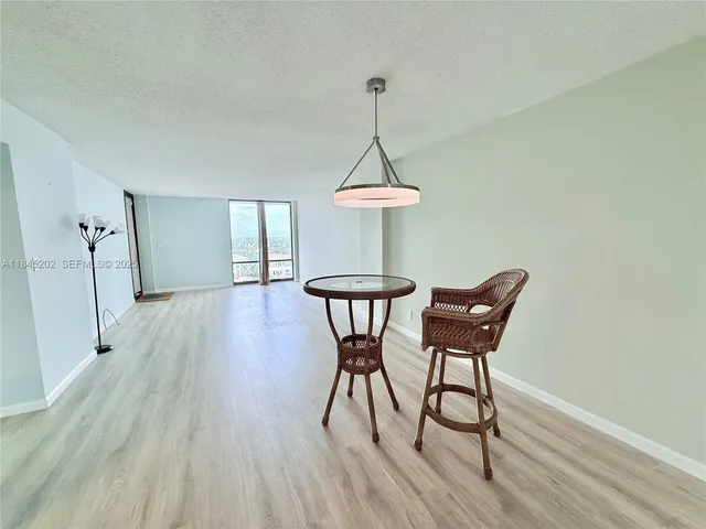 a bathroom with a sink toilet a mirror and shower