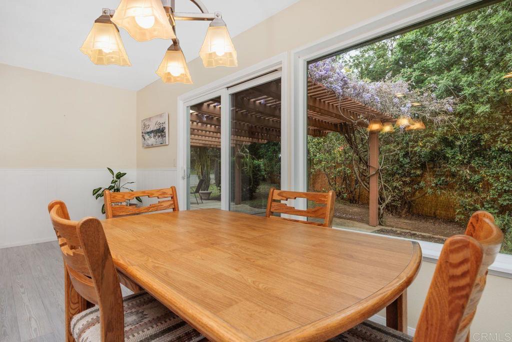 1037 Glenmere Road Vista, CA 92084 - Photo 12 of 36 a outdoor dining space with furniture and wooden floor